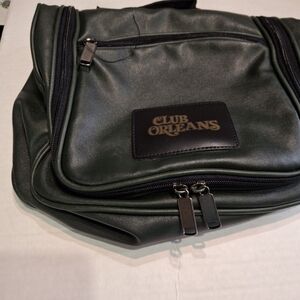 A DARK GREEN TRAVEL BAG FROM ORLEANS HOTEL LAS VEGAS LIKE NEW MANY DEPARTMENTS